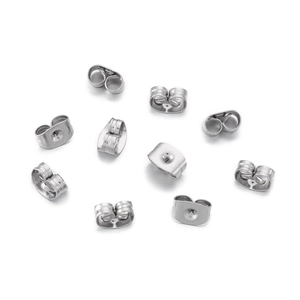 Macro detail of high-quality silver stainless steel butterfly earring backs on white