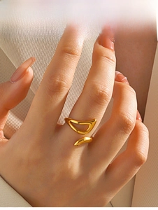 Detailed shot of an adjustable irregular geometric gold ring on a model index finger