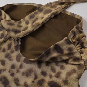 Detailed view of leopard print breathable mesh fabric with layered texture and pleats