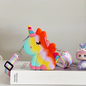 Detail of unicorn rainbow silicone pop bag on Kinfolk book with star pattern strap