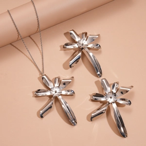 Detail of silver double-layered flower pendant necklace and earrings jewelry set