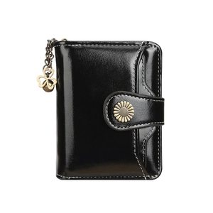 Short black leather wallet with tassel clover zipper and floral buckle on white background