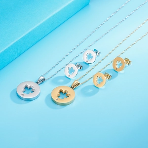 Detailed set of silver and gold stainless steel angel necklaces and clover stud earrings
