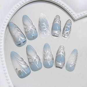 Y2K punk style press-on nails with blue gradient and 3D silver metal butterfly patterns