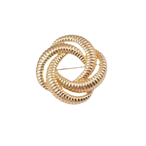Modern abstract round woven gold metal brooch with a premium minimalist fashion design