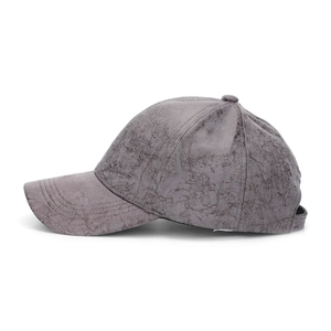 Close-up of vintage dark grey faux suede baseball cap with marble texture and stitching