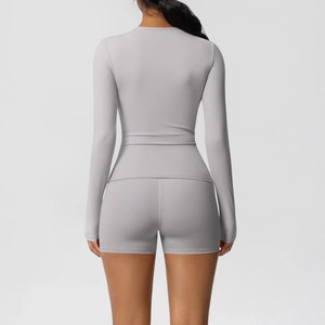 Rear view of a slim-fit gray yoga set with long-sleeve top and high-waist sports shorts
