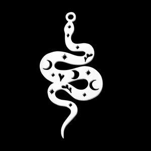 Macro shot of silver stainless steel snake pendant with star and moon cutout patterns