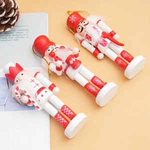 Detailed view of three 12cm red and white wooden nutcracker soldier Christmas ornaments