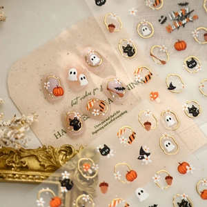 3D Halloween nail stickers with gold border pumpkins, black cats, and ghost designs
