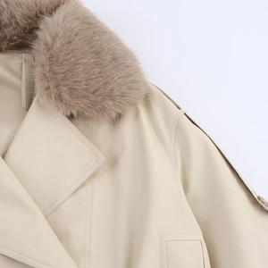 Close-up of beige waterproof windbreaker jacket featuring a soft faux fur collar and epaulets