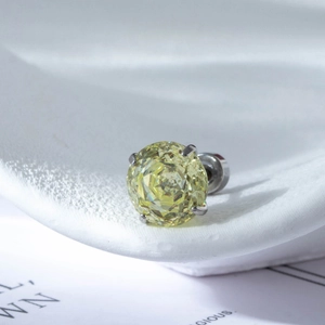 Classic stainless steel stud earring featuring a large round yellow zircon in 4-prong setting