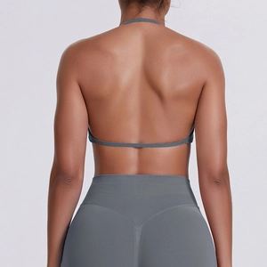 Close-up back view of grey seamless halter neck sports bra and yoga leggings set