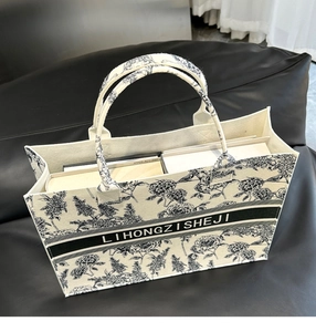 Detailed interior of a beige felt tote with blue floral prints and large capacity