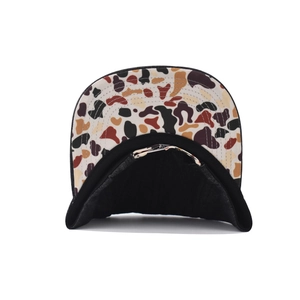 Detail view of cotton denim cap showing camouflage brim lining and metal buckle closure