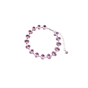 Elegant silver tennis bracelet featuring oval pink cubic zirconia stones and lobster clasp