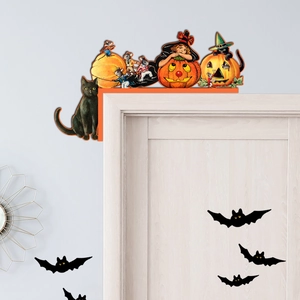 Detail of Halloween wooden door corner decor with pumpkin and black cat motifs