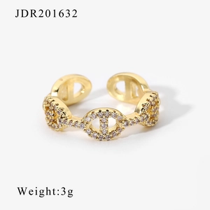 Detailed view of adjustable gold pig-nose chain ring with sparkling zircon stones