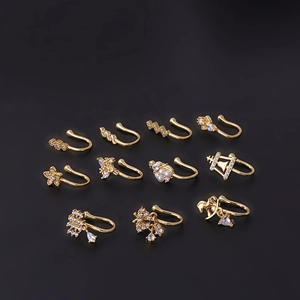 Set of 11 gold zircon and pearl non-piercing nose clips with floral and butterfly designs