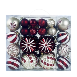 Assorted red and gold Christmas ball ornaments in a transparent gift box set