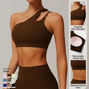 Brown asymmetric one-shoulder yoga sports bra with cut-out design and removable pads
