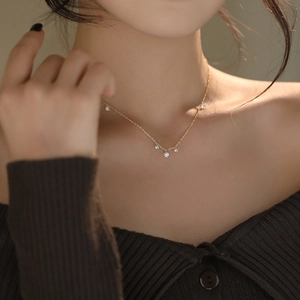 Elegant S925 sterling silver gold necklace with sparkling cubic zirconia on female model
