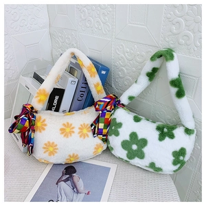Detail of furry handbags with flower patterns and decorative checkered silk scarves
