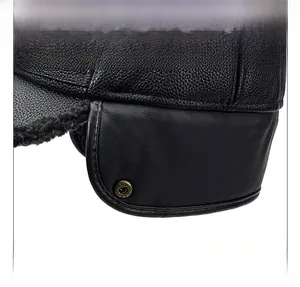 Macro shot of men's leather winter cap featuring cozy faux fur lining and ear flaps