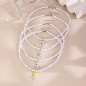 Detailed view of colorful jellyfish pendants on imitation pearl necklaces in various pastel shades