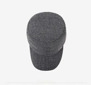 Top-down view of a grey winter cadet cap for men with a warm knit texture and metal tag