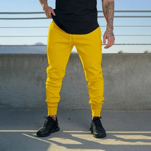 Detail of yellow joggers showing adjustable drawstring waistband and soft sports fabric