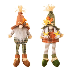 Pair of autumn plush gnomes with maple leaves, sunflowers and acorns for harvest decor