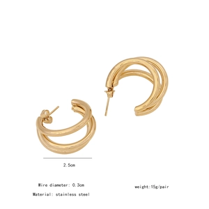 Detailed view of gold multi-layered C-shaped earrings with 2.5cm diameter measurements