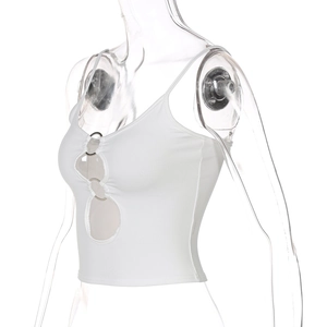 Close-up of white cropped tank top with hollow-out front and silver metal rings