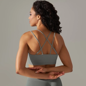 Detail of dark grey cross-back sports bra featuring seamless ribbed elastic straps
