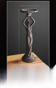 Detail shot of vintage iron angel candle holder showing the 36cm height and 12cm tray size