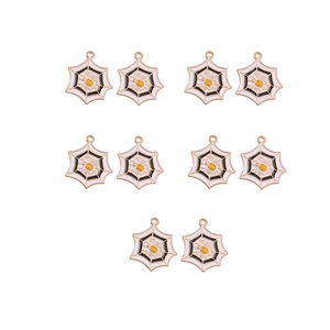 Close-up of ten enamel spider web charms with yellow bees for DIY jewelry making