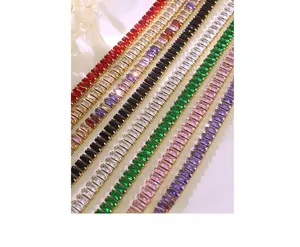 Detailed view of tennis jewelry set with colorful baguette cut zircon in gold plating