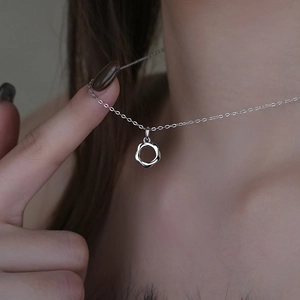Elegant S925 sterling silver Mobius loop necklace worn by a model with a minimalist pendant