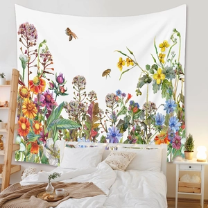 Detail of floral tapestry featuring watercolor wildflowers and bees as bedroom wall decor