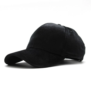 Detailed close-up of premium black velvet baseball cap fabric texture and panel stitching