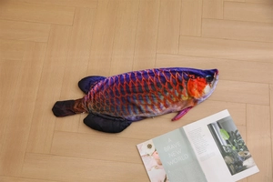 Detailed close-up of a colorful dragon fish plush shell with realistic scale printing
