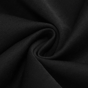 Detailed macro view of black high-density knit fabric texture with elegant drape and soft sheen