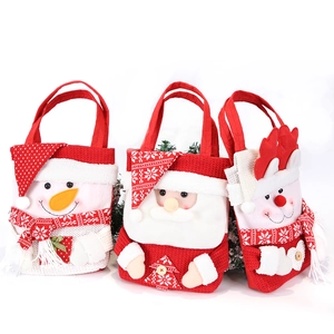 Three large Christmas gift bags with Snowman, Santa, and Reindeer designs on white background