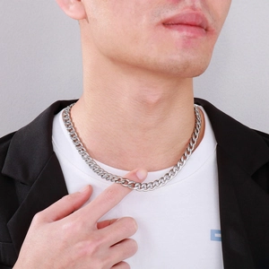 Silver stainless steel Cuban chain necklace shown on a model neck for styling