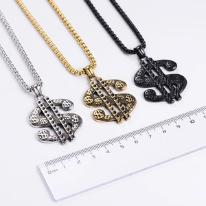 Detailed comparison of gold, silver and black dollar sign necklaces with scale measurement
