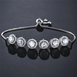Detailed close-up of a silver bolo bracelet featuring six micro-pave cubic zirconia stones