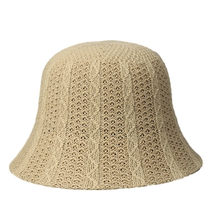 Women's beige knit bucket hat with diamond crochet pattern on a clean white background
