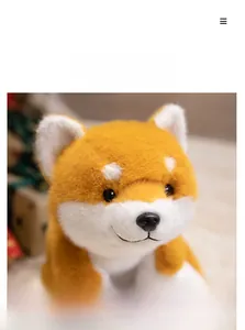Detailed close-up of a Shiba Inu plush toy showing soft fur texture and cute smile