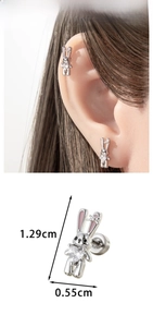 Detailed view of silver rabbit stud earrings with pink enamel and heart zircon stones